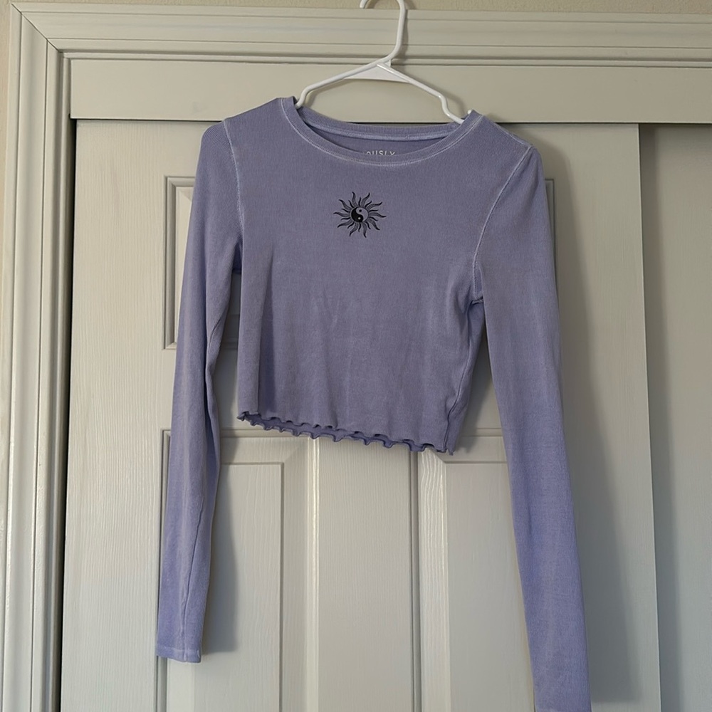 Purple long sleeve with small graphic in the middle